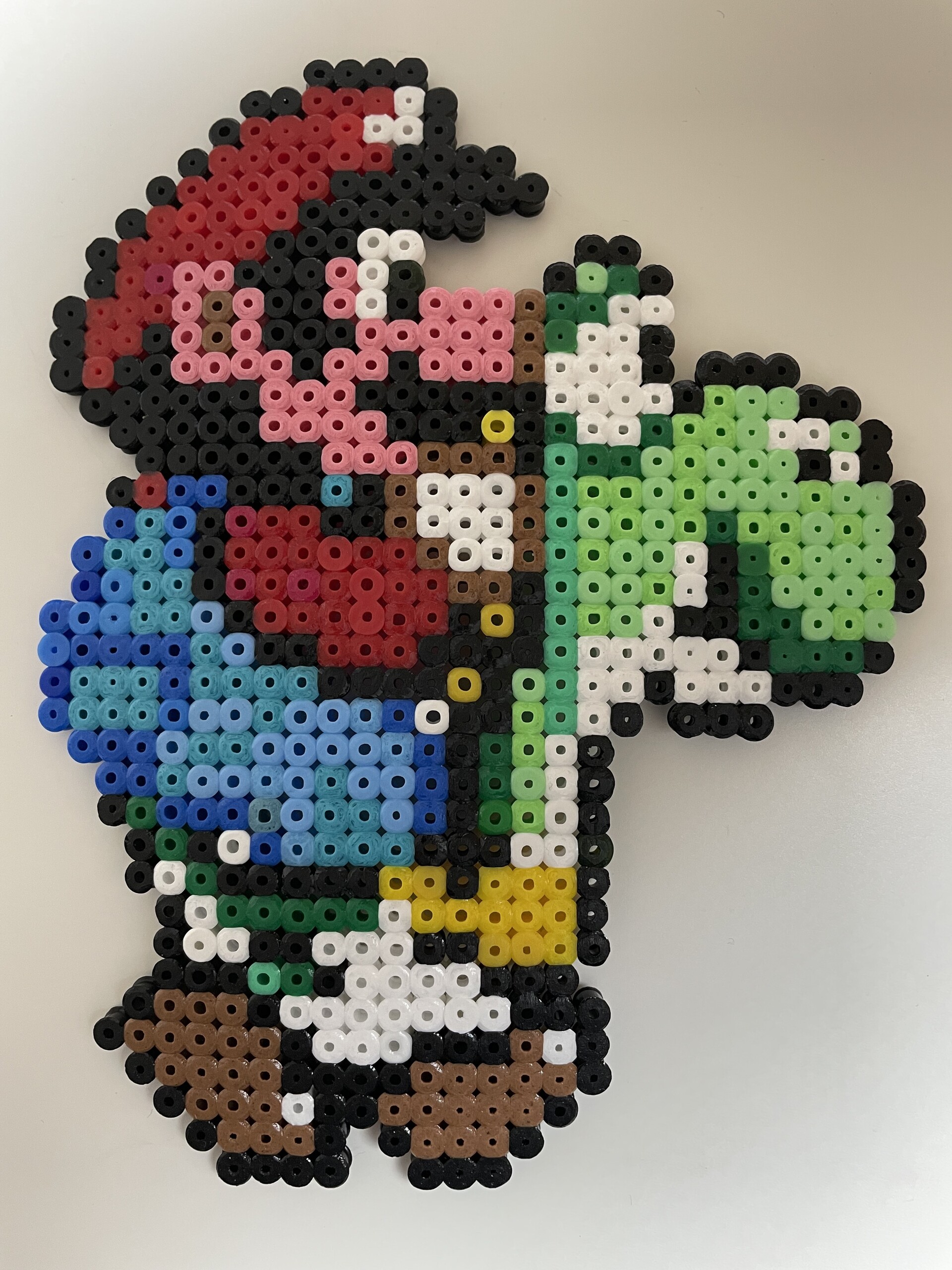 Mario riding green Yoshi, made with fuse beads